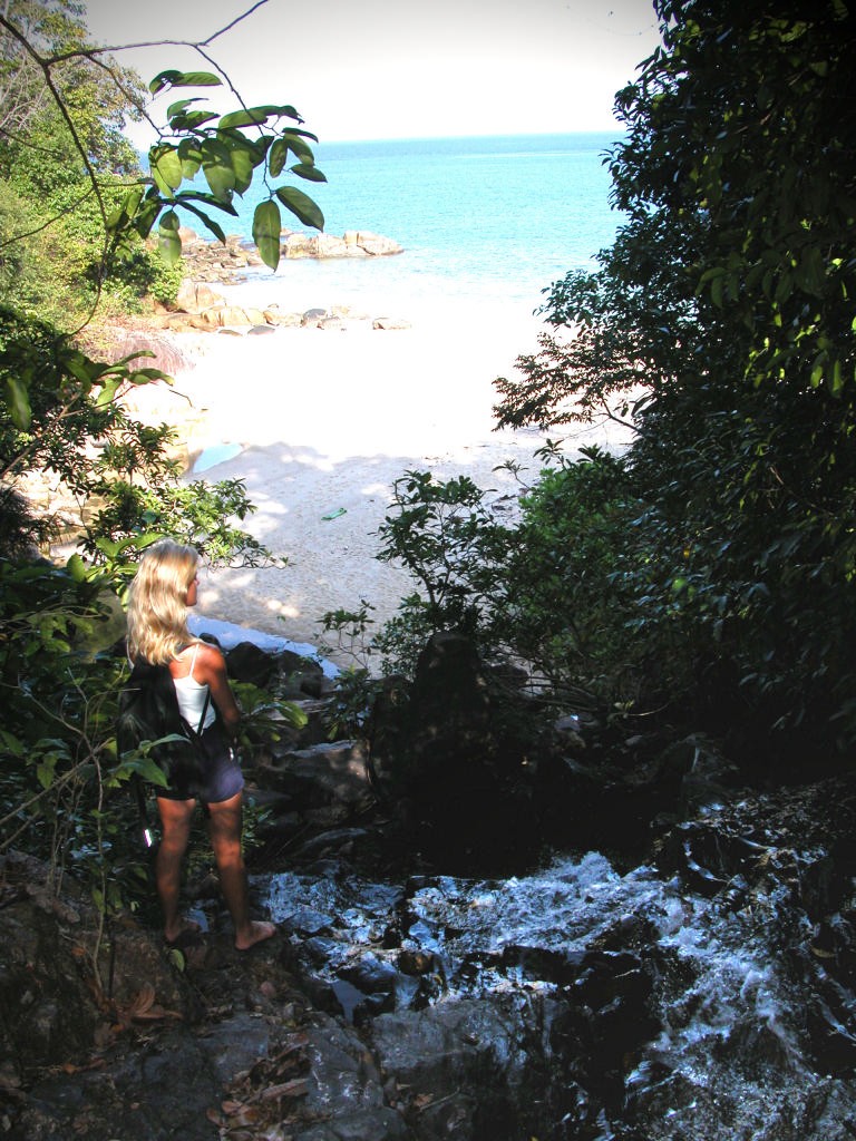 An icy cold mountain waterfall tumbles directly into the sea. © Paul Johnson http://www.boat-yacht-charters.com